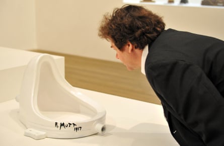 A visitor looks Marcel Duchamp’s Fountain, 1917, at Tate Modern, London, in 2008.