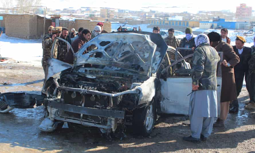 Security forces at site of previous bomb attack in Feroz Koh, capital of Ghor province, on 15 December.