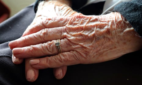 The hands of an older woman