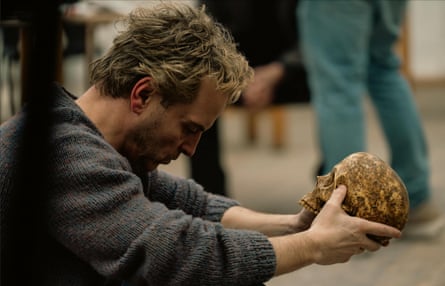 Andrew Scott, playing Ian Charleson, holds a skull in the film Elsinore.