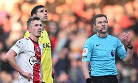 James Ward-Prowse, Emiliano Martínez, and referee Michael Salisbury react as a drone stops play at St Mary’s.