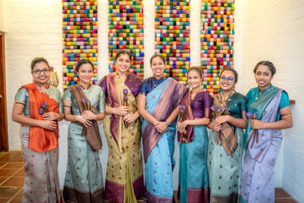 A line up of female staff wearing saris at Amba Yaalu