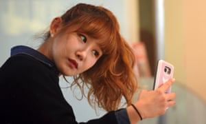 Jung Hye-yoon of K-pop group SixBomb takes a selfie in Seoul, South Korea.