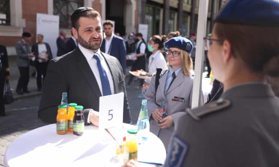 Rabbi Zsolt Balla chats with Jewish members of the Bundeswehr, Germany’s armed forces, following his inauguration as the first federal rabbi of the Bundeswehr at the main synagogue in Leipzig, Germany. 