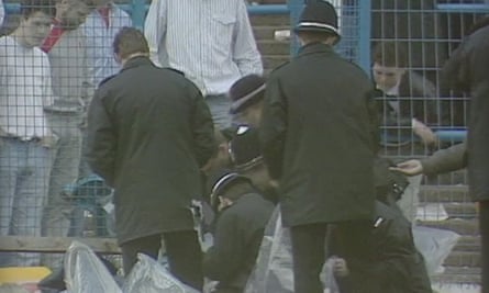 Police collect evidence shortly after the Hillsborough disaster.