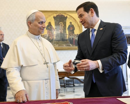 Leo and Rubio with a small crystal American football in his hand.