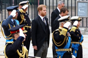Prince Harry stands next to King Charles, Princess Anne and Prince William as they salute during the state funeral