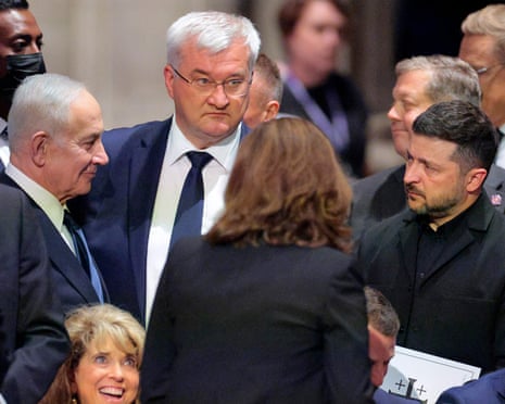Benjamin Netanyahu, Andrii Sybiha and Volodymyr Zelenskyy in conference in a funeral reception crowd