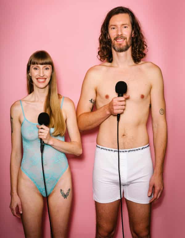Flynn Talbot and Lacey Haynes in their underwear holding microphones