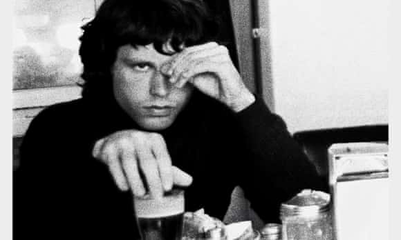 Bobby Klein's portrait of the Doors' Jim Morrison having beer for breakfast, at the Lucky U restaurant in West Los Angeles in 1967