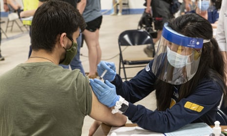 Nursing student Allie Rodriguez administers a coronavirus vaccine dose in Kent, Ohio.