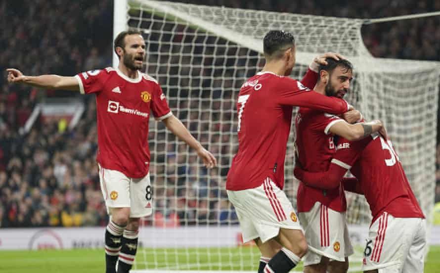 Manchester United’s Bruno Fernandes, second right, celebrates after scoring his side’s opening goal.