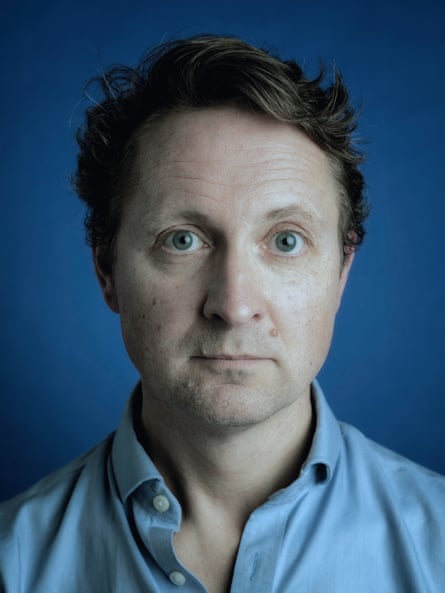 A head-and-shoulders photo of Arthur Snell, looking at the camera without expression