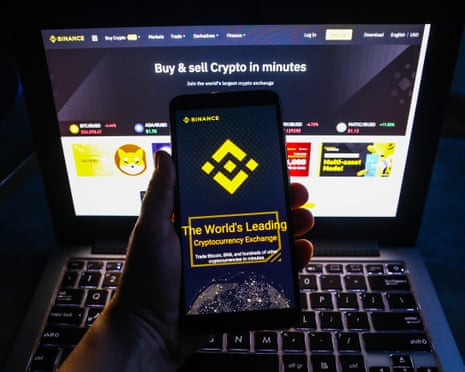 Binance website is displayed on a mobile phone screen