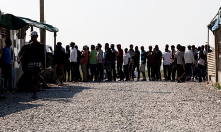 A queue for food at the overcrowded Calais refugee camp.