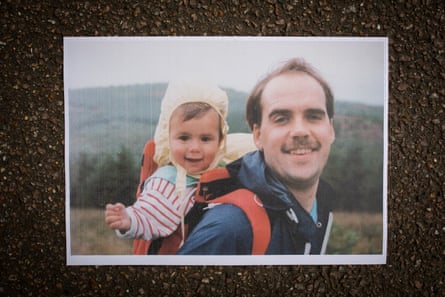 Anil as a baby being carried by his dad
