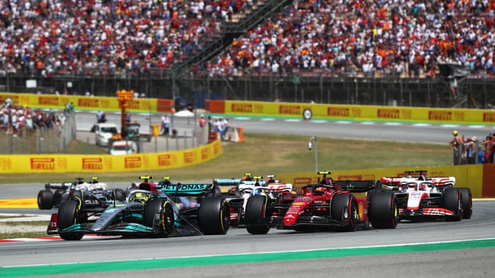 Lewis Hamilton has a puncture on the opening lap.