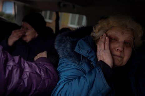 Marina Batrak reacts as she is evacuated from her home in Selydove, Ukraine on Tuesday, after an increase of Russian missile strikes on settlements in the area around Avdiivka.