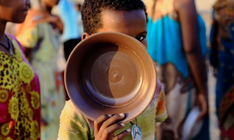 An Ethiopian child queues for food at the Um-Rakoba camp, on the Sudan-Ethiopia border in Al-Qadarif state, Sudan.