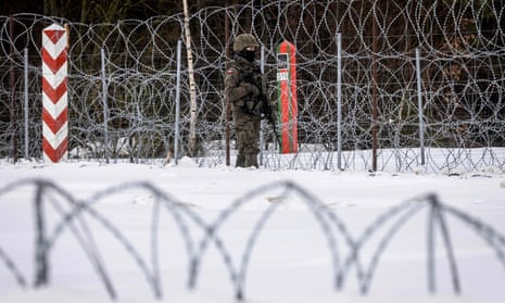 A Polish soldier patrols the Polish-Belarusian border in Sokółka County, Podlasie, in northeastern Poland, 25 January 2022