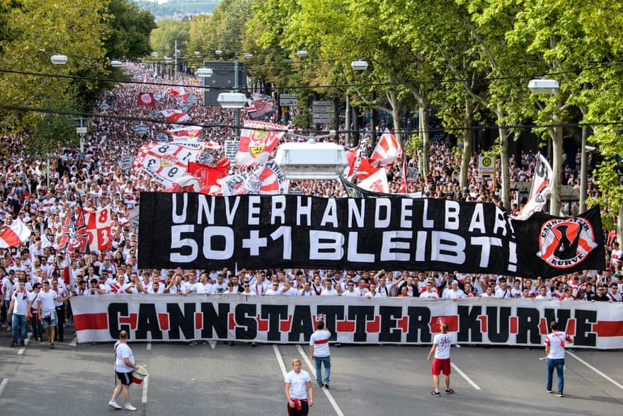 Thousands of Stuttgart fans march to the stadium ahead of their match against Bayern Munich in 2018. Their banner reads “Non-negotiable! 50 + 1 remains!”