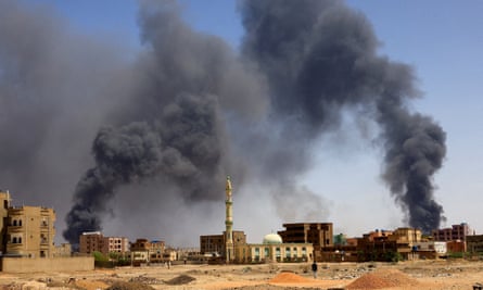 Smoke rises above buildings after an aerial bombardment during clashes between the paramilitary Rapid Support Forces and the army in Khartoum.