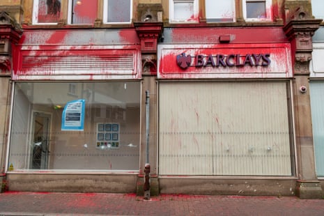 Red paint thrown over Barclays bank.