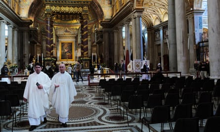 Priests and visitors inside the basilica