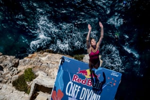 Ginni van Katwijk reaches her hands into the air as she prepares to dive