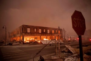 Buildings smolder in downtown Greenville, in Plumas county.