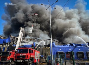 Fire engines and a helicopter tackle a blaze