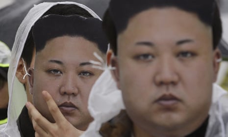 North Korean defectors in Kim Jong-un mask at a protest rally in Seoul. Dzhon changed his identity when he arrived in the South 