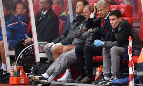 Arsenal manager Arsène Wenger scratches his head during the game at Stoke City