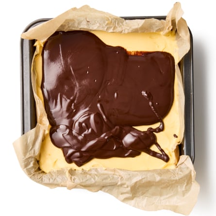 And this picture show the melted butter and chocolate mixture spread upon the custard layer.