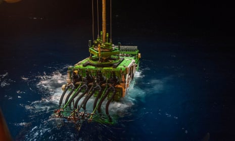 The deep-sea mining robot Patania II is lowered into the Pacific Ocean to begin a descent to the sea floor, in April 2021. 