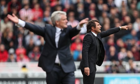 The two managers – Mark Hughes, left, and Antonio Conte – get animated on the touchline.