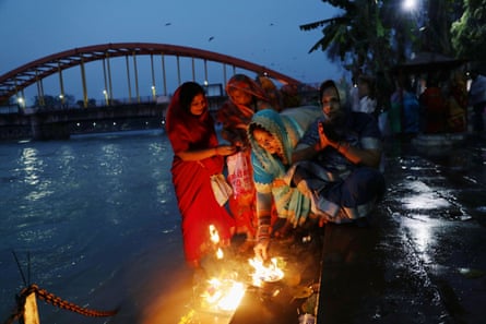 A group of omen pray on the banks of Ganges River ahead of the first Shahi Snan at “Kumbh Mela” or the Pitcher Festival, in Haridwar, India, March 10