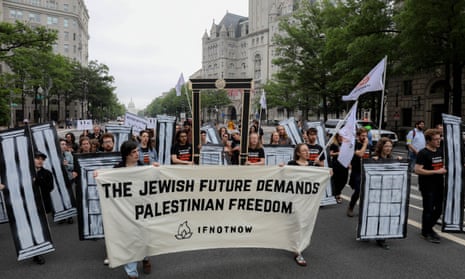 Demonstrators march towards Trump Hotel in Washington on Monday to protest against the relocation of the US embassy from Tel Aviv to Jerusalem.
