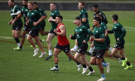 Damien Cook and Latrell Mitchell with their South Sydney teammates during a training session at Redfern Oval this week.