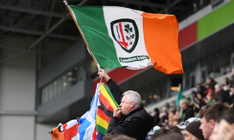 A fan of London Irish waves a flag during the Premiership game against Exeter in March