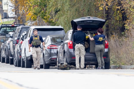 Members of the FBI Evidence Response Team gather at the site of a mass shooting at Schemengees Bar and Grille on October 26, 2023 in Lewiston, Maine.