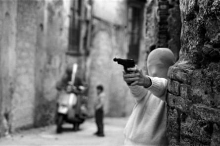 Child with a gun in Palermo, 1982.