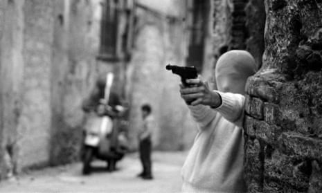 ‘People were afraid even to look at my photographs’ … child with a gun in Palermo, 1982, which appears in Shooting the Mafia. 