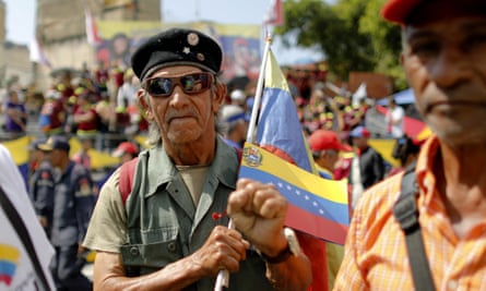 A supporter of Venezuela’s president Nicolás Maduro outside the Supreme Court where he is sworn-in for a second term.