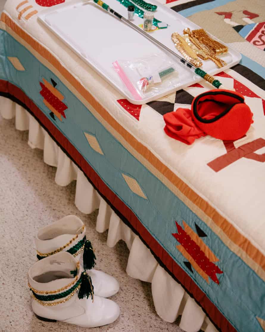 Boots and accessories of Sun City Proms cheerleader Mary Zirbel on and beside her bed