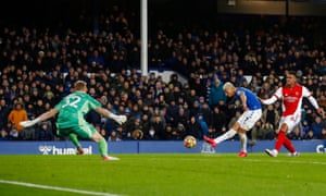 Everton’s Richarlison scores their first goal.