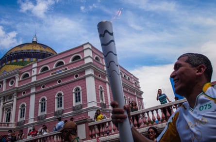 Euler Ribeiro Filho carries the Olympic torch in Manaus, Brazil