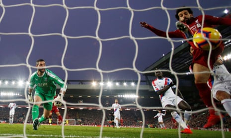 Liverpool’s Mohamed Salah scores his second after Julián Speroni’s error.