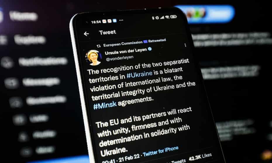 A phone screen with Twitter updates