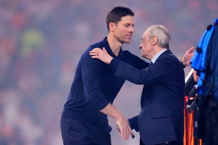 Xabi Alonso and the Real Madrid president, Florentino Pérez, greet after the Spanish Super Cup final.